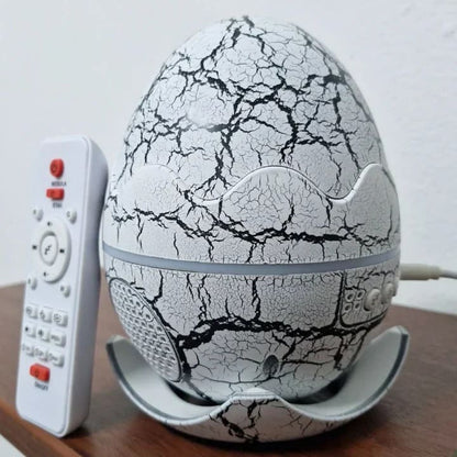 Parlante y Proyector de Estrellas de Huevo de Dinosaurio 5 en 1